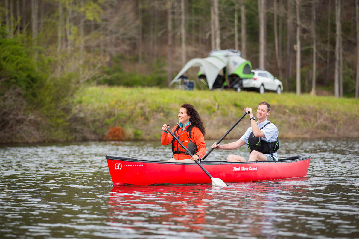 Stephanie and Ray Adams Canoeing canoeing with camper