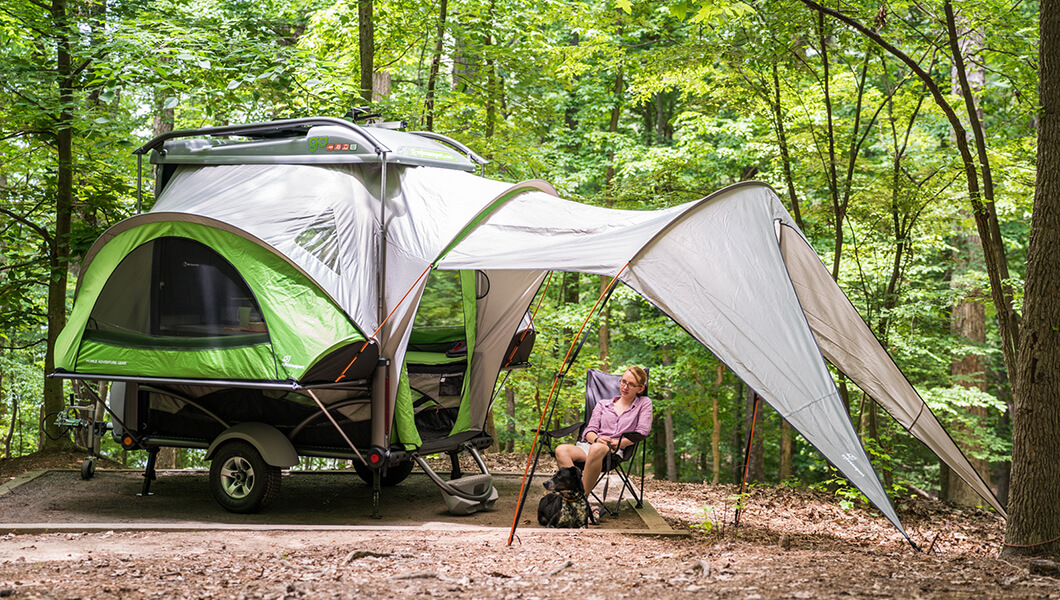 Mike Dever, Cindy Dever and Rebecca Harris enjoy the Sylvan Sport GO with a class B camper