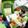 family eating inside GO Camper