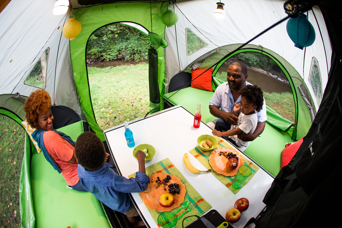 family eating inside GO Camper