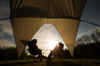 people sitting with awning open