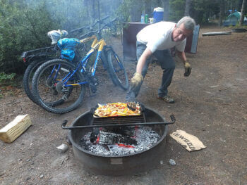 men cooking campfire