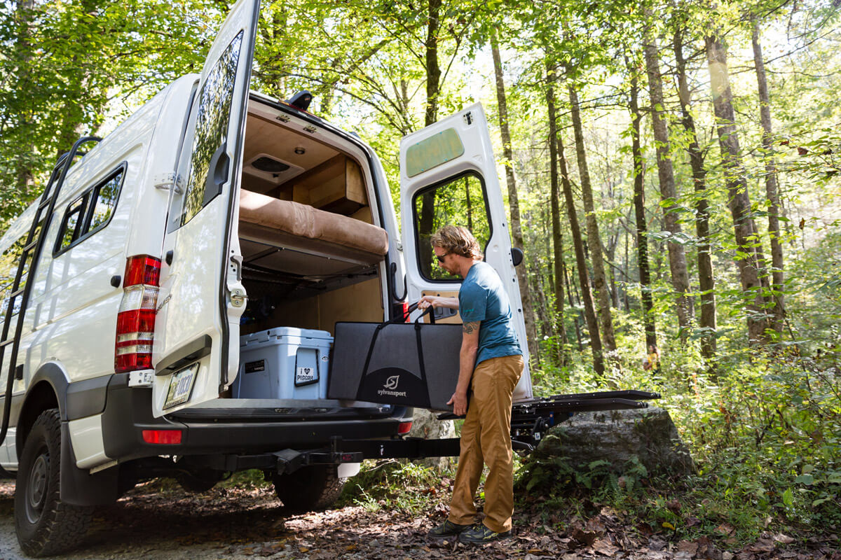 men unloading Camp Kitchen