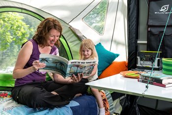 woman and kid sitting GO Camper bed