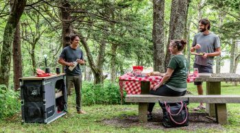people eating campground using Dine O Mite Camp Kitchen