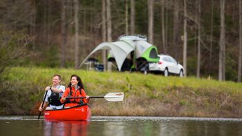 couple paddling GO Camper with Subaru Outback