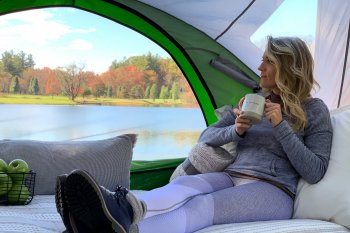 woman laying down drinking coffee