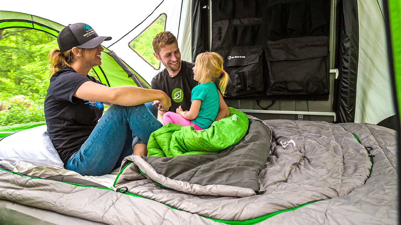 family inside Go Camper with sleeping bag