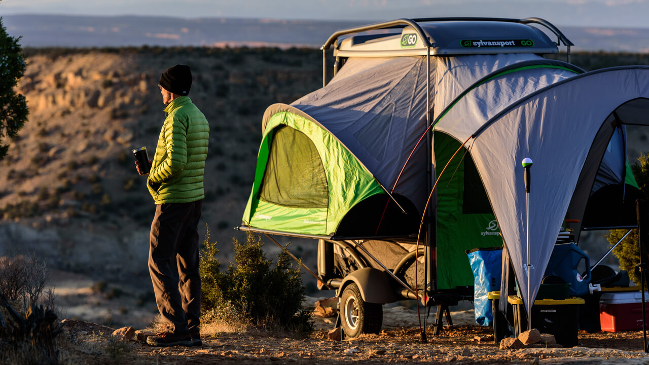 GO Camper with men at sunrise