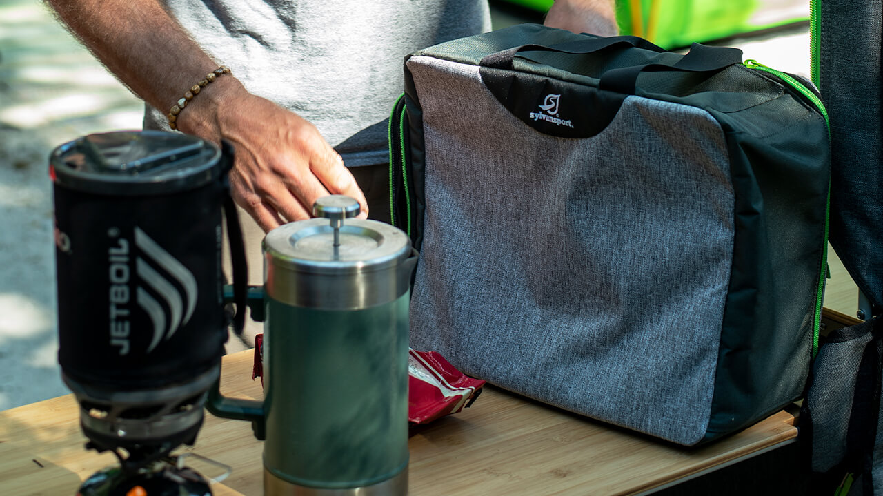 Men using packing cube SylvanSport coffee