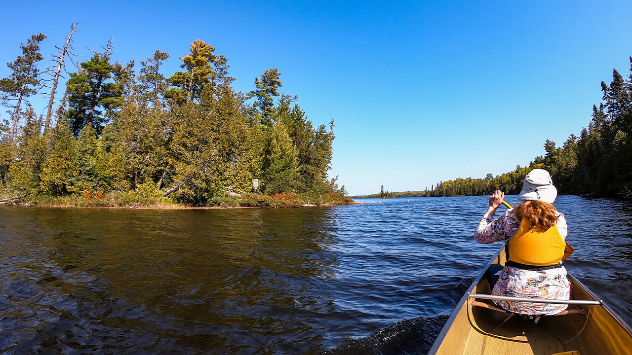 woman paddling a kayak