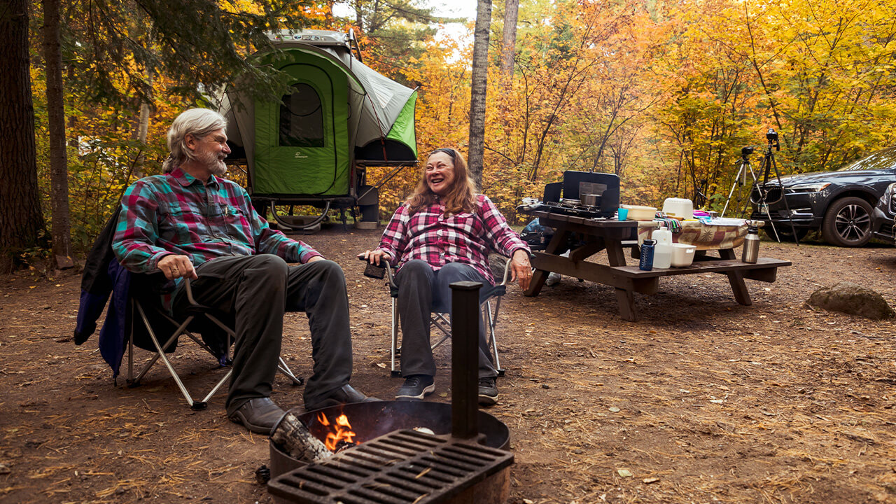 couple around the camp fire