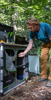 Men using camp kitchen campsite