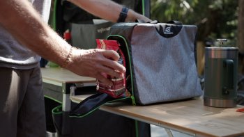 Men putting coffee bag inside packing cube SylvanSport