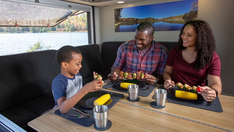 family eating inside VAST