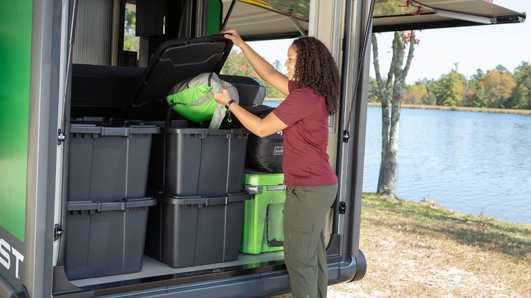 woman taking backpack VAST Storage