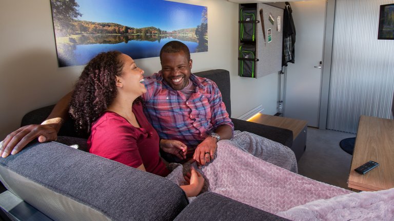 couple sitting on the couch VAST lounge