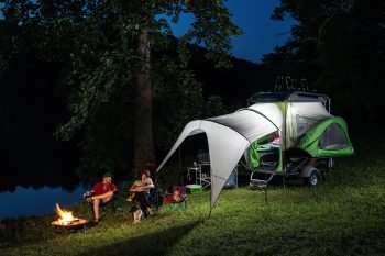 Family camping dogs with GO trailer and awning open