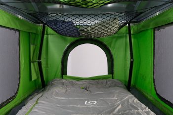 LOFT-rooftop-tent- inside- sleeping bag and bungee net gear