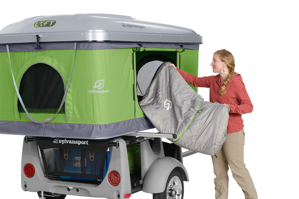 LOFT Rooftop Tent Sleeping Bag LOFT-rooftop-tent- women with sleeping bag studio photo