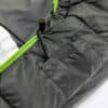 Close-up of Cloud Layer sleeping bag with green zipper and black drawstring.