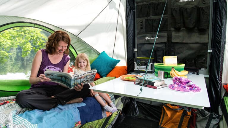 Family enjoying camping in a SylvanSport trailer tent.