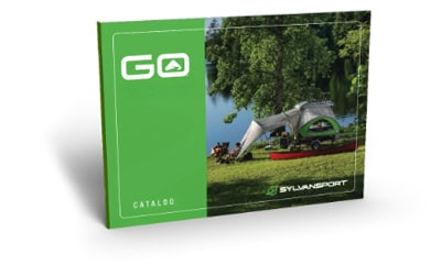 SylvanSport GO camping trailer catalog cover with tent setup outdoors.