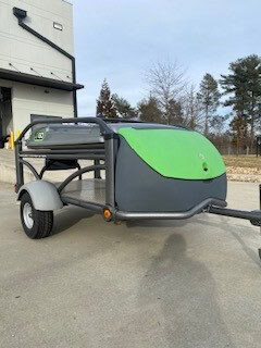 Compact SylvanSport Optima trailer with green and black exterior, ready for outdoor adventures.