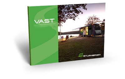 VAST Travel Trailer with SylvanSport branding and outdoor camping setup.