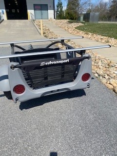 Optima trailer by SylvanSport with roof racks for versatile outdoor gear transport.