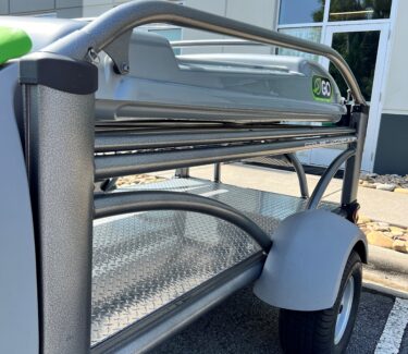 Heavy-duty SylvanSport Optima utility cart with metal shelves and wheels.