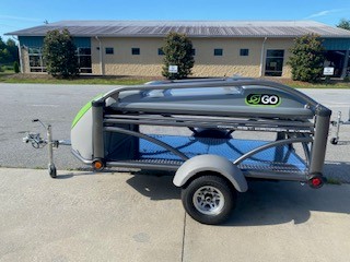 SylvanSport GO trailer with gear storage and compact design for outdoor activities.