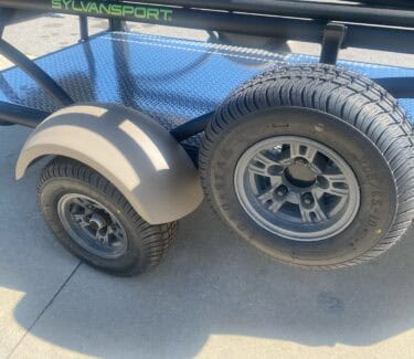 Close-up of SylvanSport Optima trailer wheels and frame.