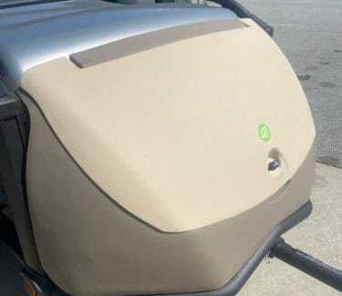 Close-up of SylvanSport Optima trailer with beige exterior and compact design.