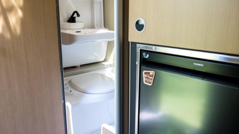 Compact SylvanSport VIRE travel trailer with built-in bathroom and kitchen.