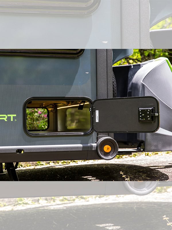 SylvanSport VIRE travel trailer with external utility connection and wheel.