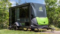 SylvanSport Vire compact travel trailer in outdoor setting with trees.
