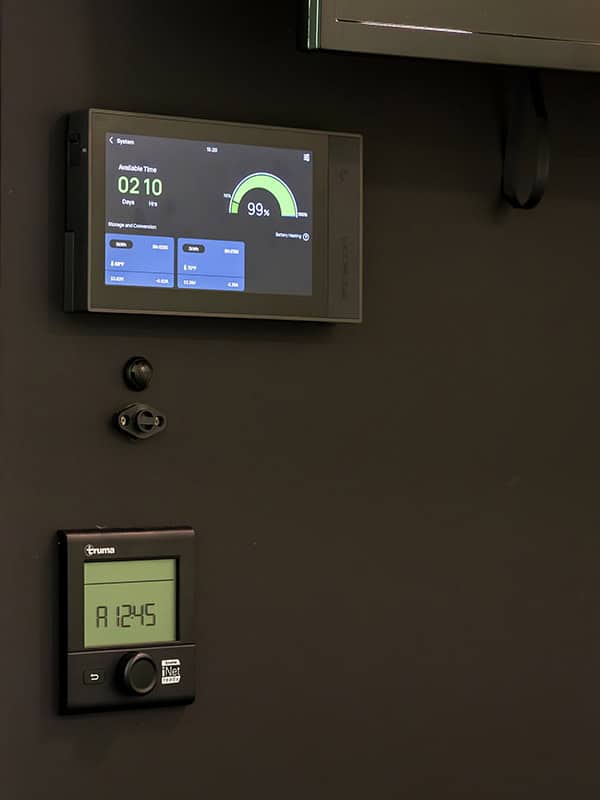 Digital control panels inside a SylvanSport VIRE Travel Trailer.